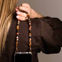 Selencia Transparent Case with Hooks + Lova Wrist Strap Tortoise Leopard Apple iPhone 17 - Earth Tones